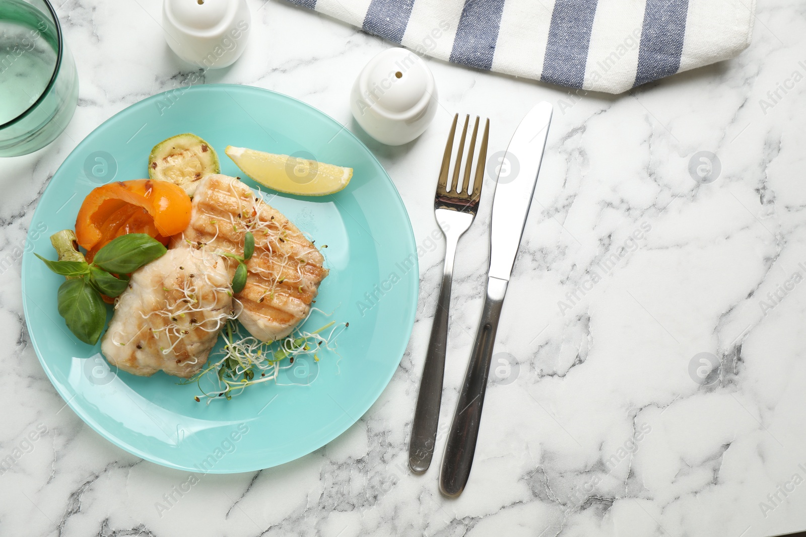 Photo of Flat lay composition with grilled fish on marble table