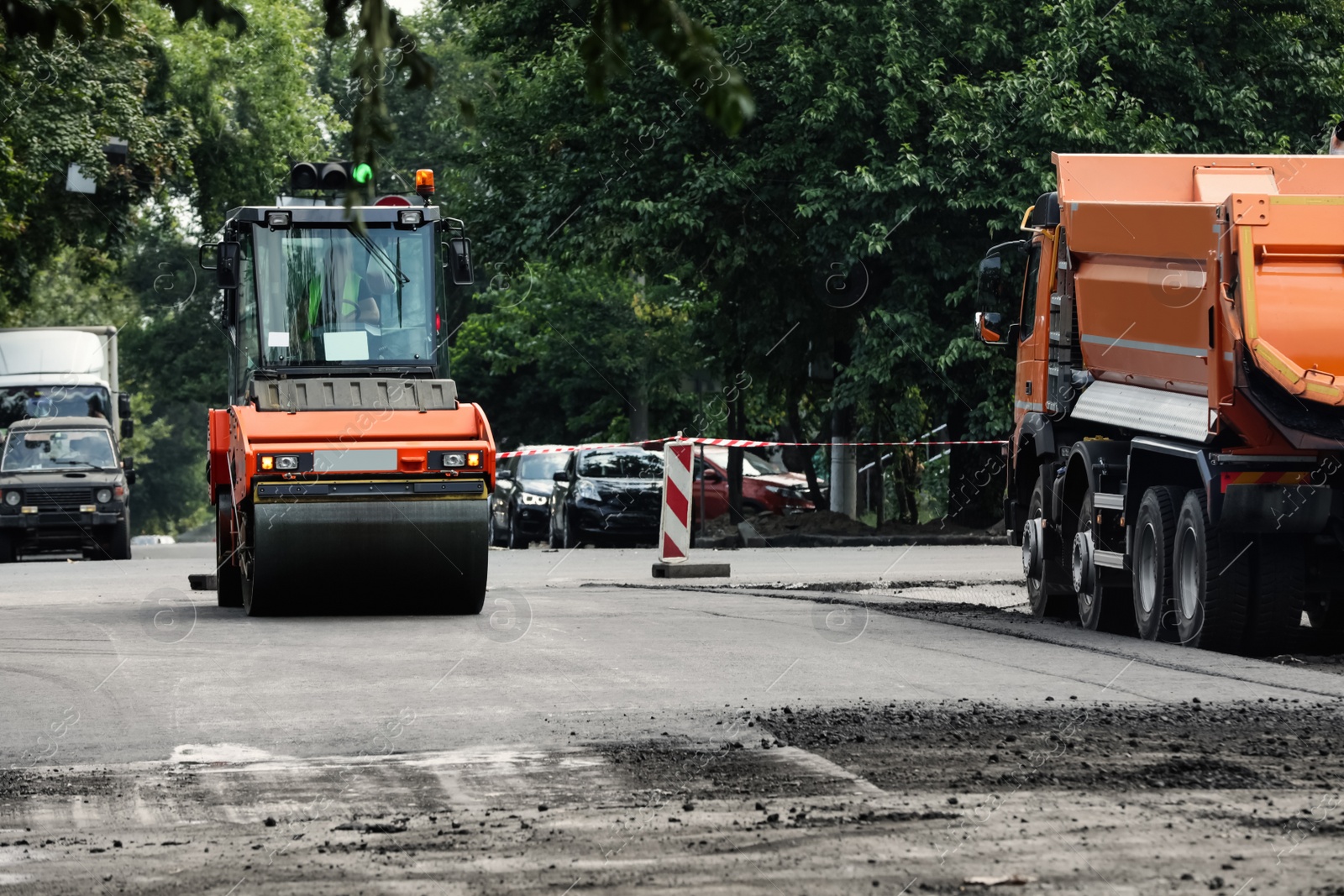 Photo of Road repair machinery working on city street