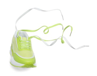 Photo of One stylish light green sneaker isolated on white