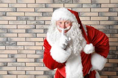 Photo of Authentic Santa Claus on brick wall background