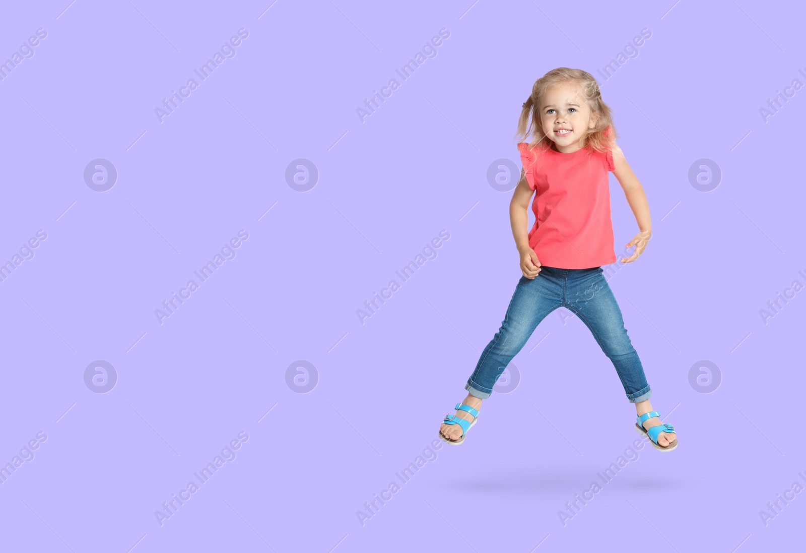 Image of Cute girl jumping on lavender background, space for text