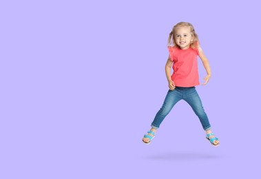 Cute girl jumping on lavender background, space for text