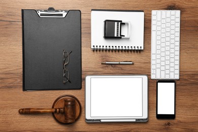 Flat lay composition with modern tablet on wooden table. Space for text