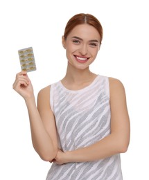 Happy young woman with pills on white background. Weight loss