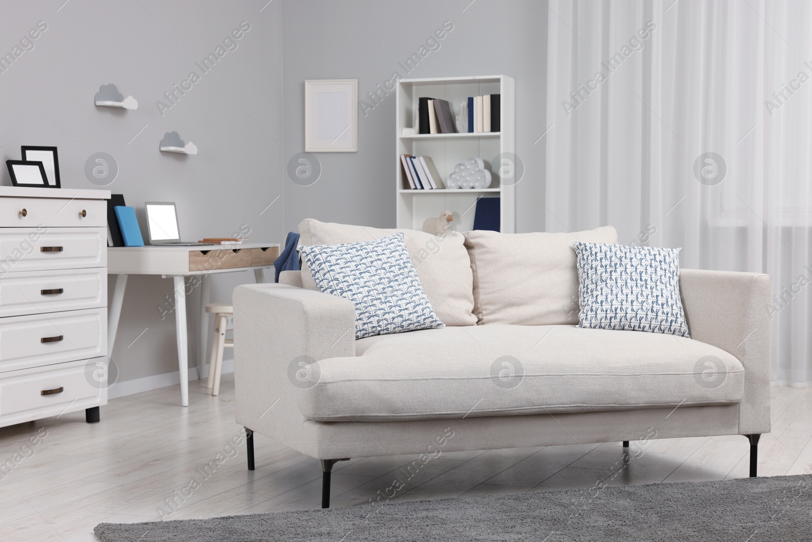 Photo of Stylish living room with comfortable sofa. Beautiful interior