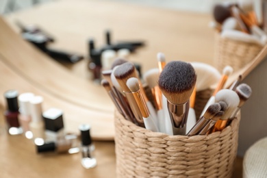 Photo of Brushes on dressing table in makeup room