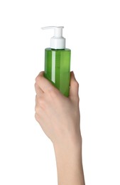 Photo of Woman holding bottle of face cleansing product on white background, closeup