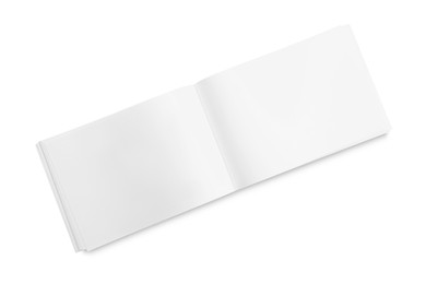 Photo of Open blank paper brochure isolated on white, top view. Mockup for design