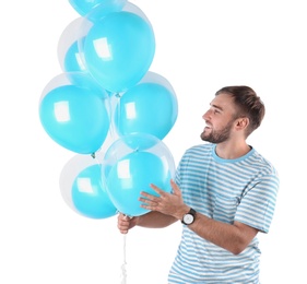 Photo of Young man with air balloons on white background