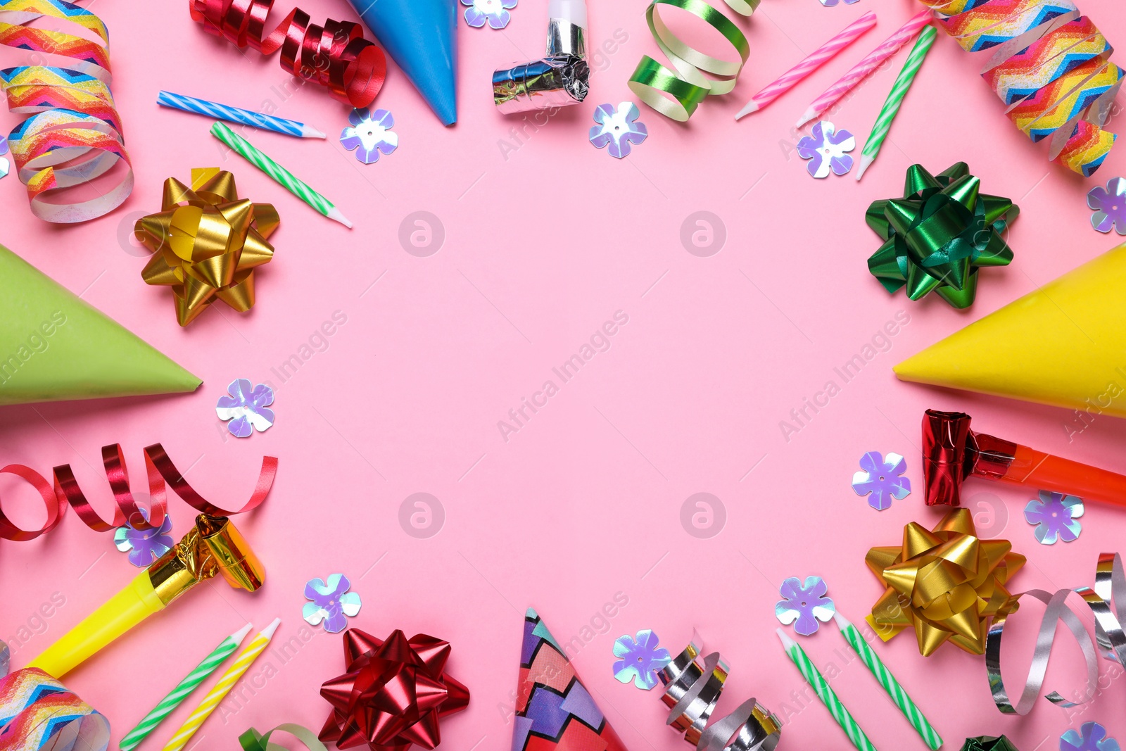 Photo of Flat lay composition with party items on pink background, space for text. Birthday celebration