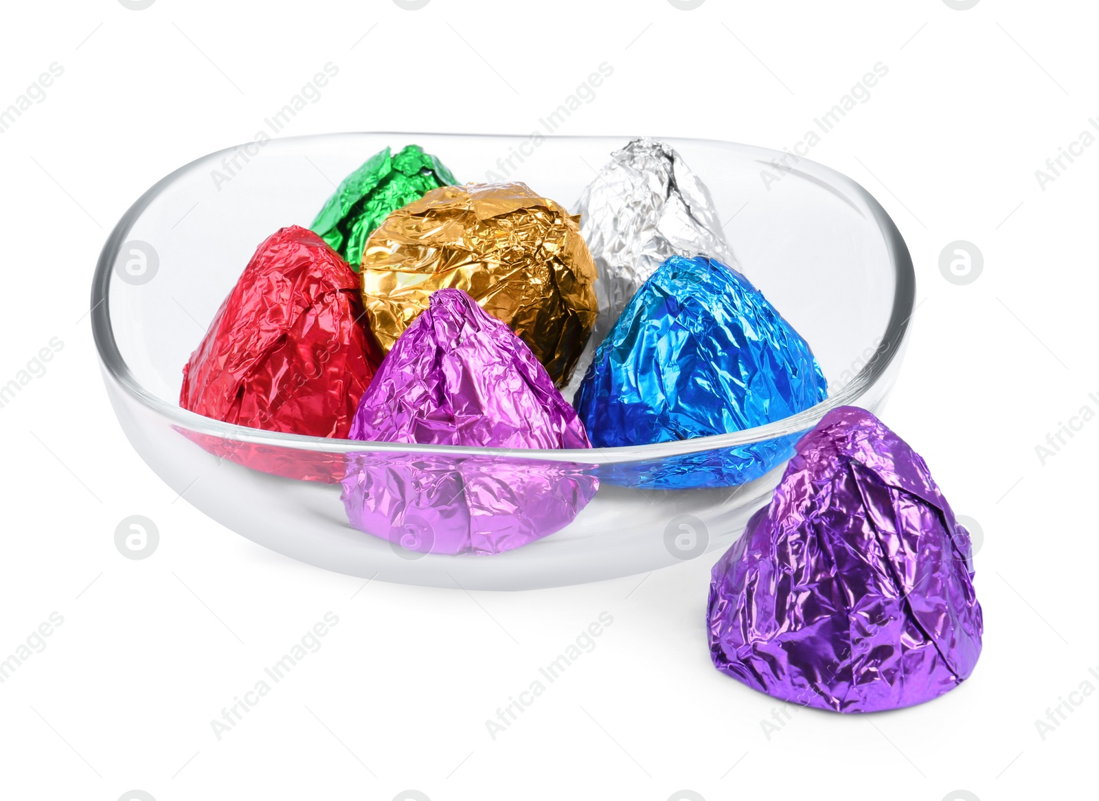Photo of Bowl with many tasty candies in colorful wrappers isolated on white