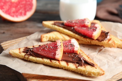 Tasty toasts with grapefruit, chocolate paste and chia seeds on board