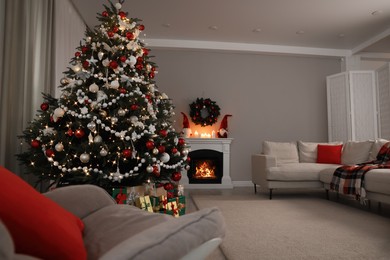 Photo of Beautiful Christmas tree and many gift boxes in stylish living room interior