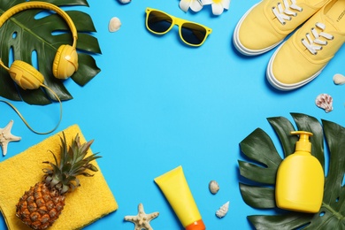 Flat lay composition with beach accessories on color background, space for text