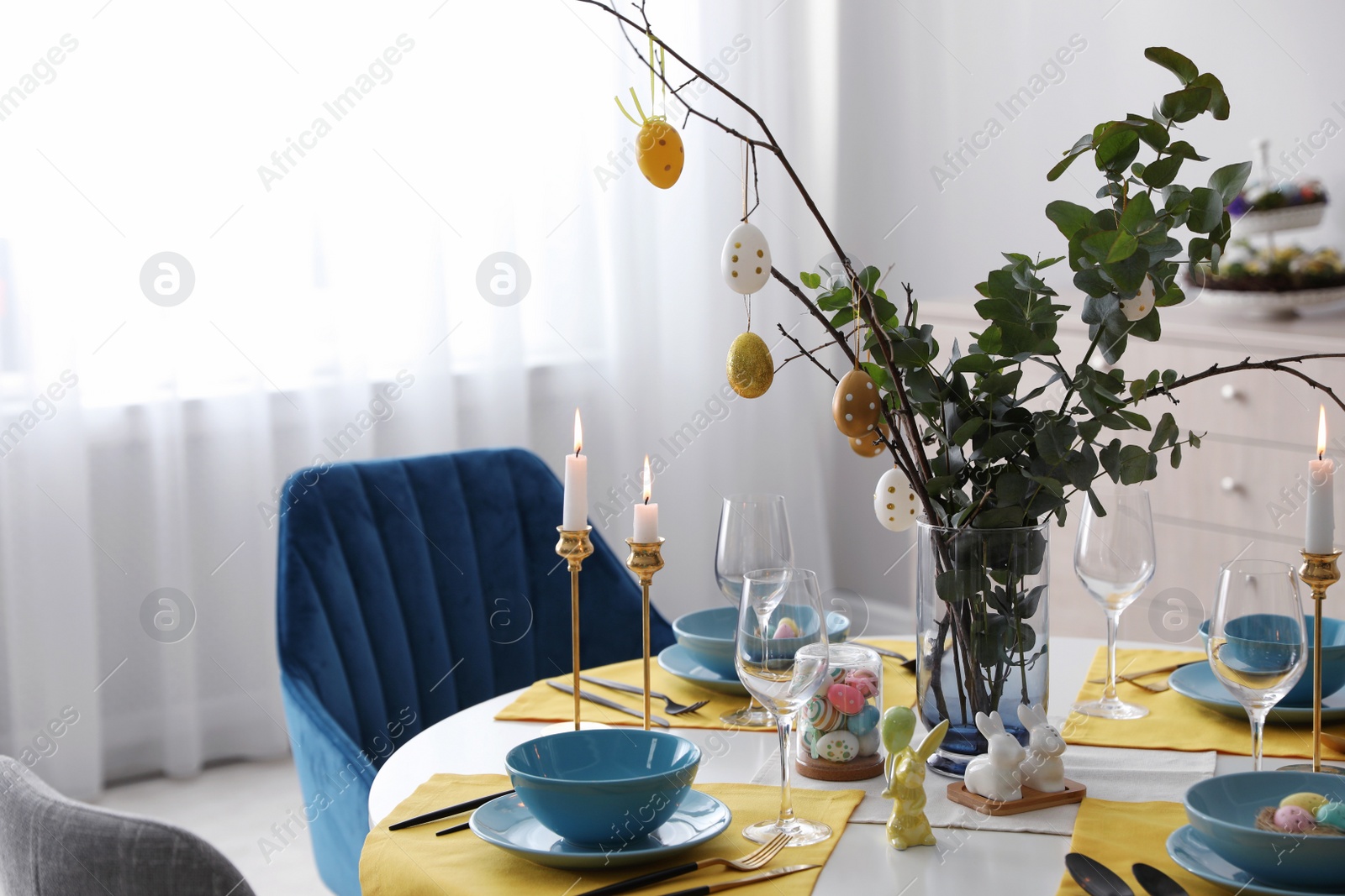 Photo of Beautiful Easter table setting with festive decor indoors