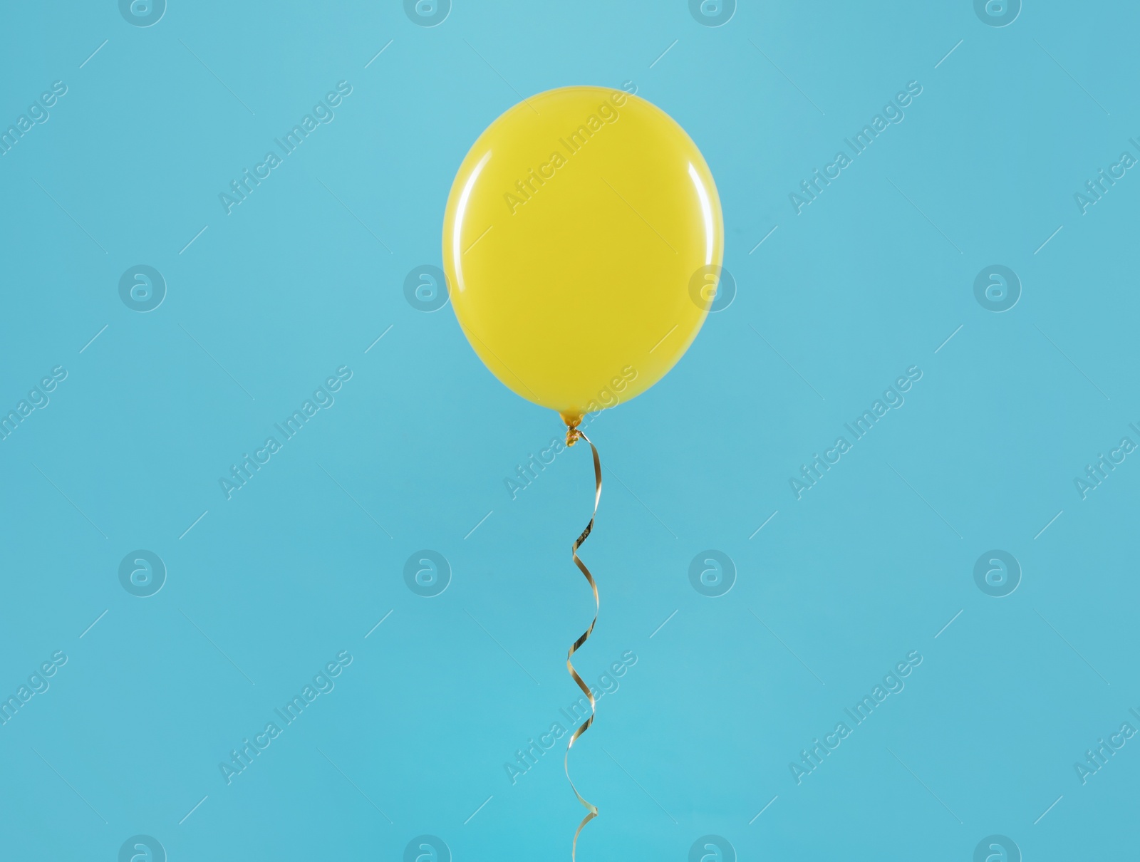 Photo of Bright balloon on color background. Celebration time