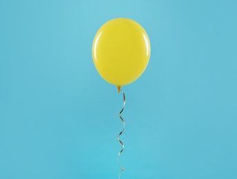 Bright balloon on color background. Celebration time