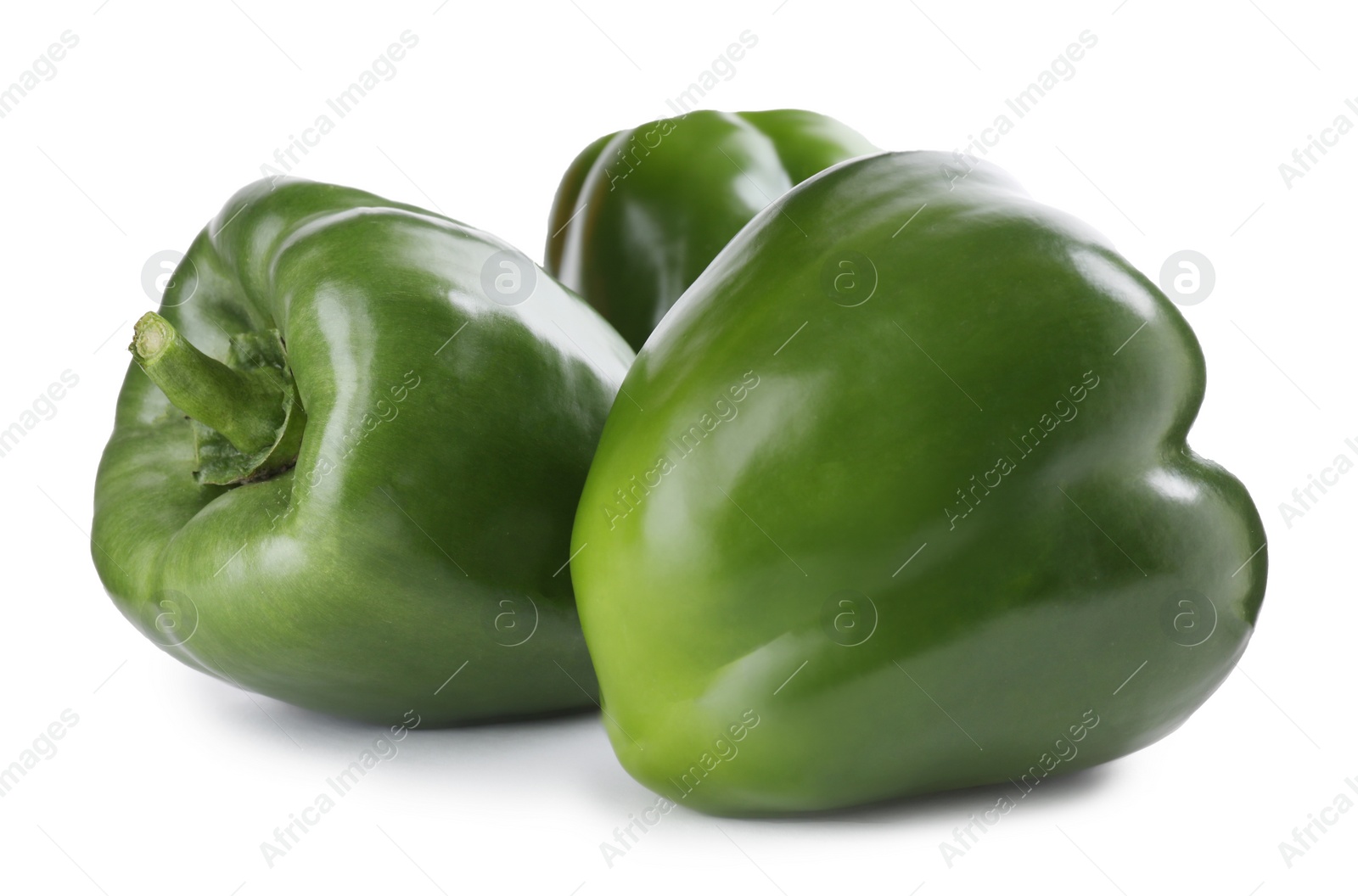 Photo of Ripe green bell peppers isolated on white