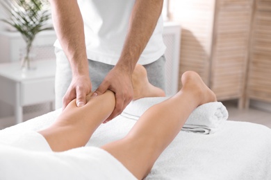 Young woman receiving massage in salon, closeup