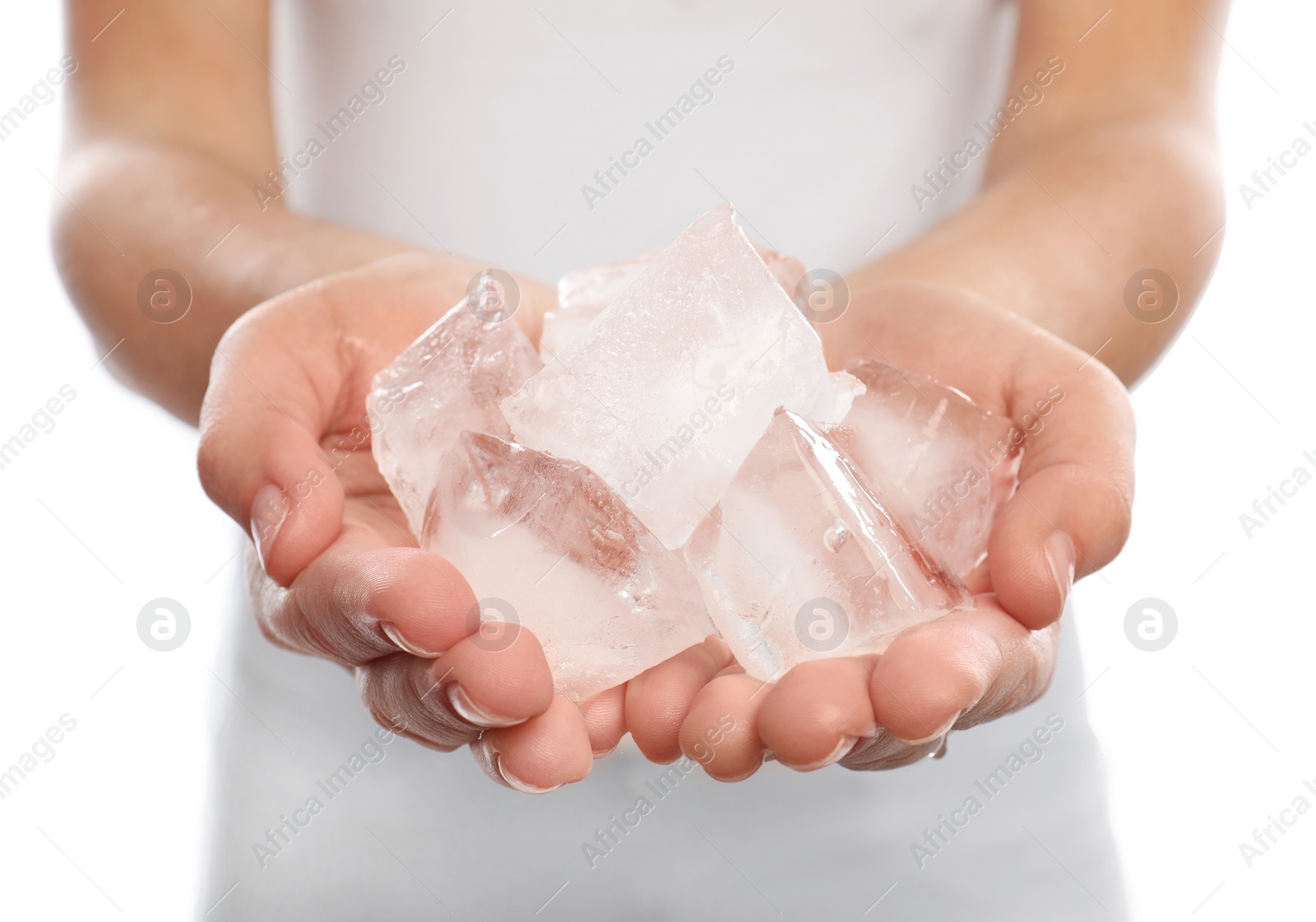 Photo of Woman holding many ice cubes on white background, closeup