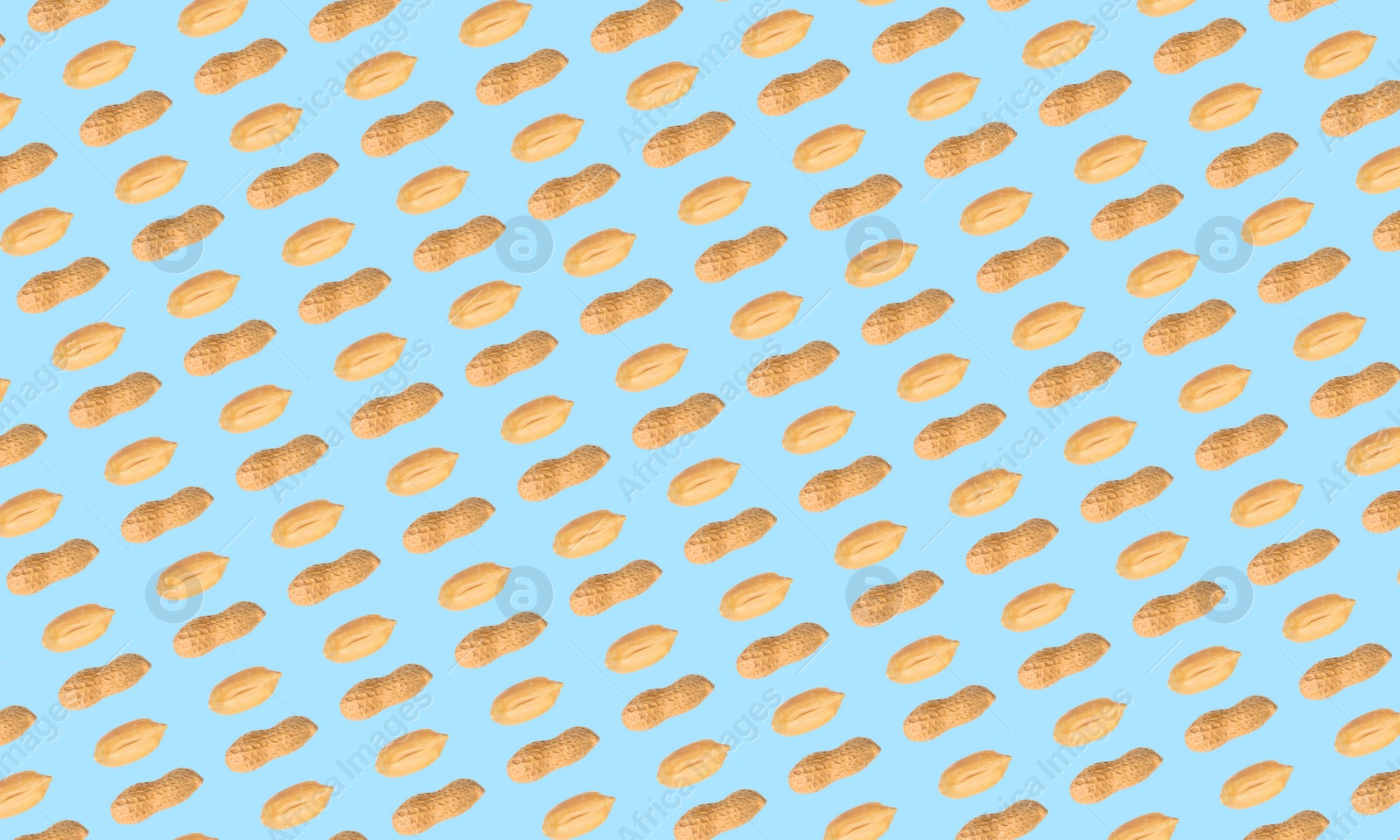 Image of Pattern of peanuts on light blue background