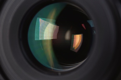 Camera lens of professional photographer, closeup view