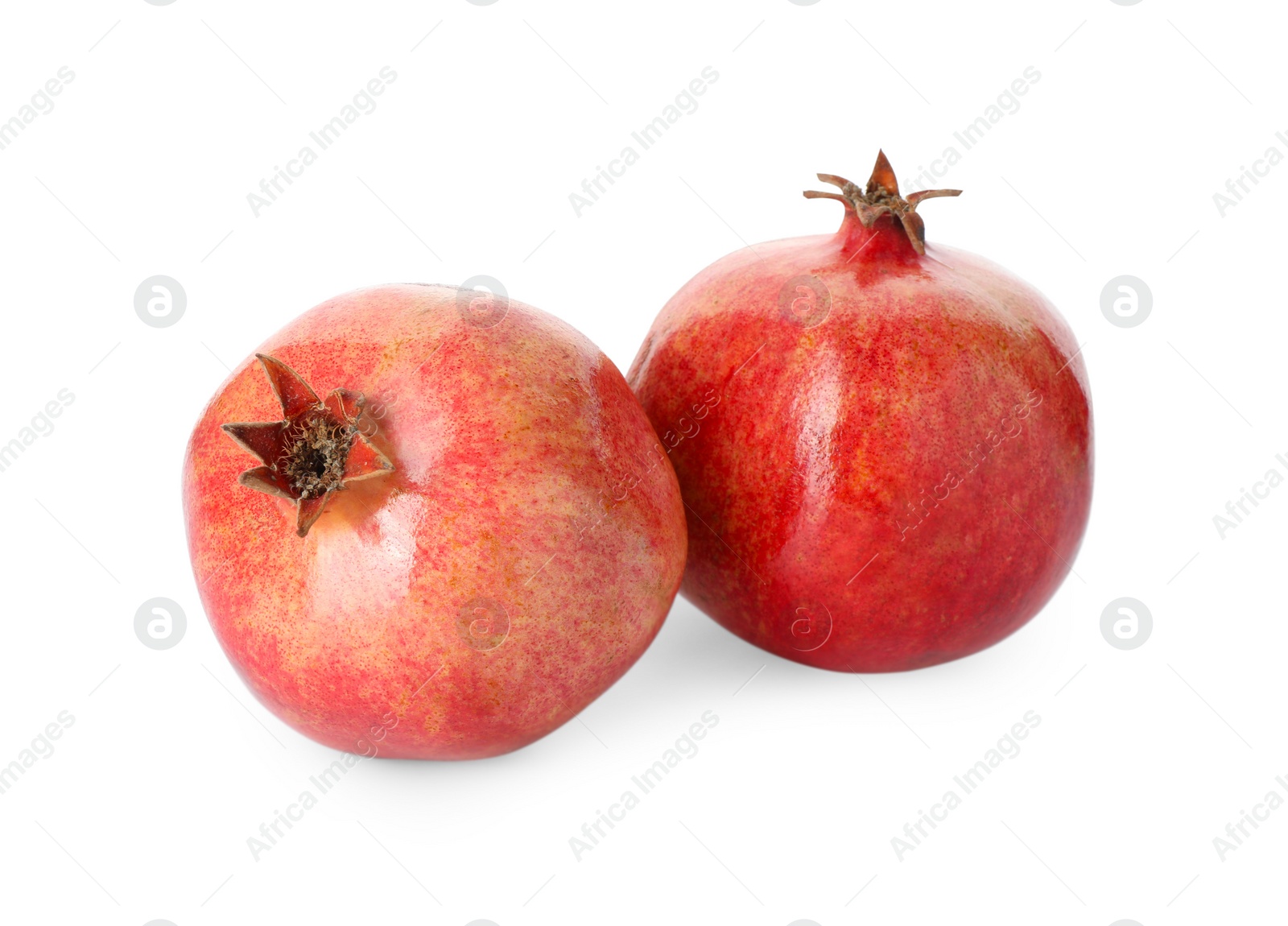 Photo of Two fresh ripe pomegranates isolated on white