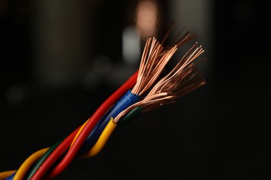 Electric wires on blurred background, closeup view
