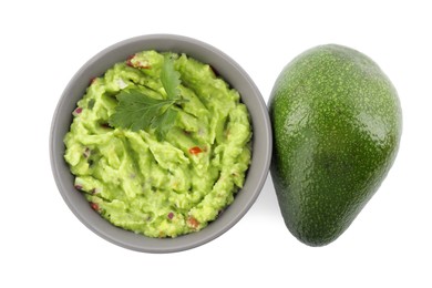 Photo of Delicious guacamole and fresh avocado isolated on white, top view