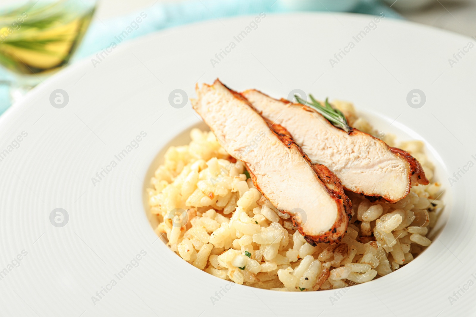 Photo of Delicious fresh chicken risotto in plate, closeup