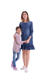 Happy woman and daughter in stylish clothes on white background