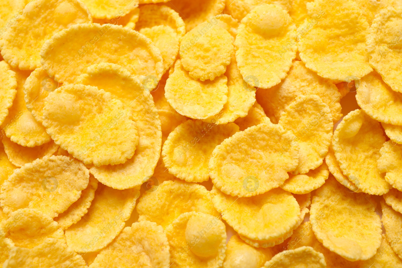 Photo of Tasty crispy corn flakes as background, top view