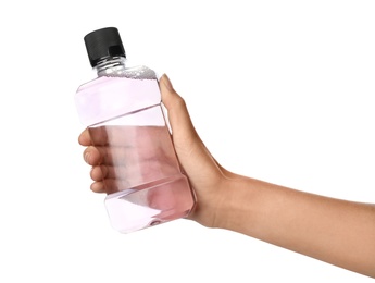 Photo of Woman holding bottle with mouthwash for teeth care on white background