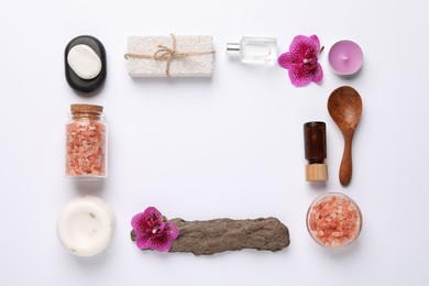 Flat lay composition with different spa products on white background. Space for text