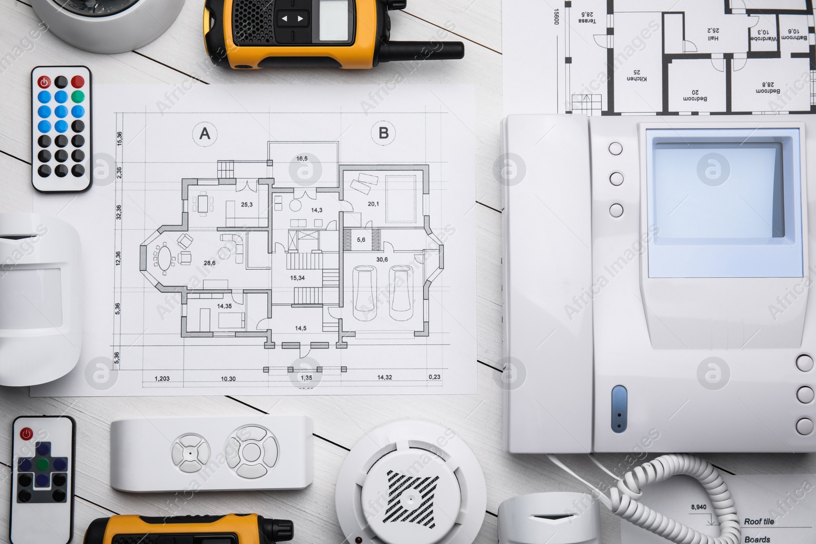 Photo of Flat lay composition with equipment for home security system on white wooden table