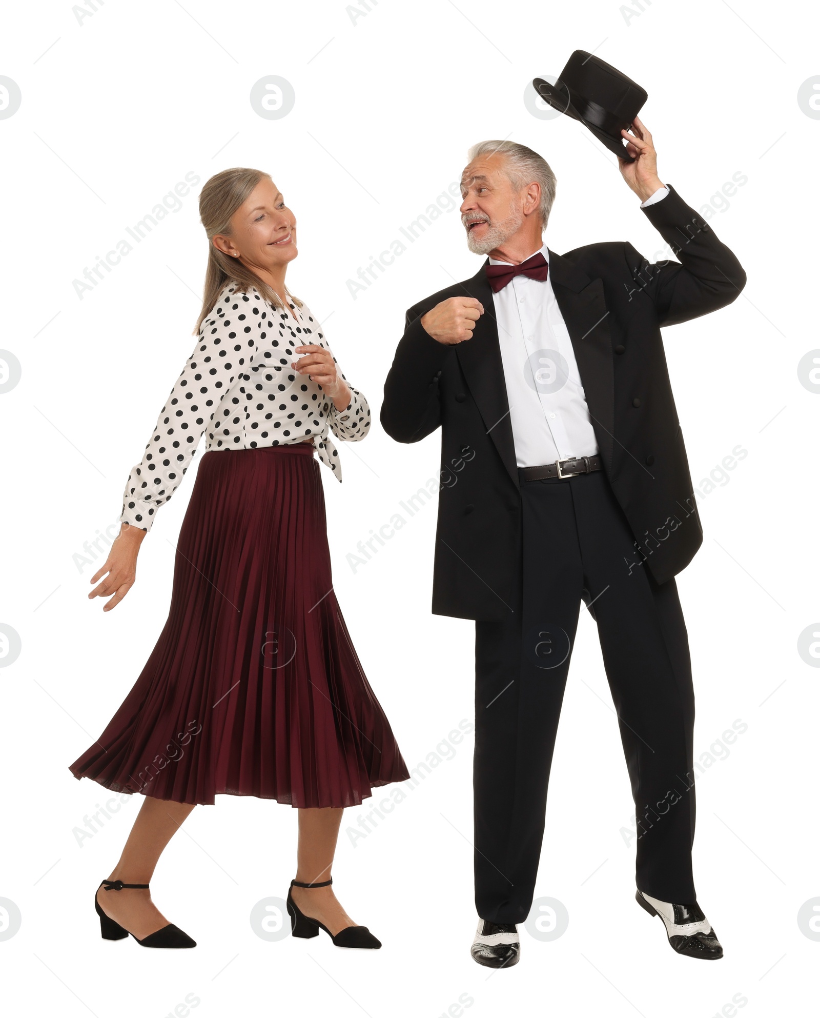 Photo of Senior couple dancing together on white background