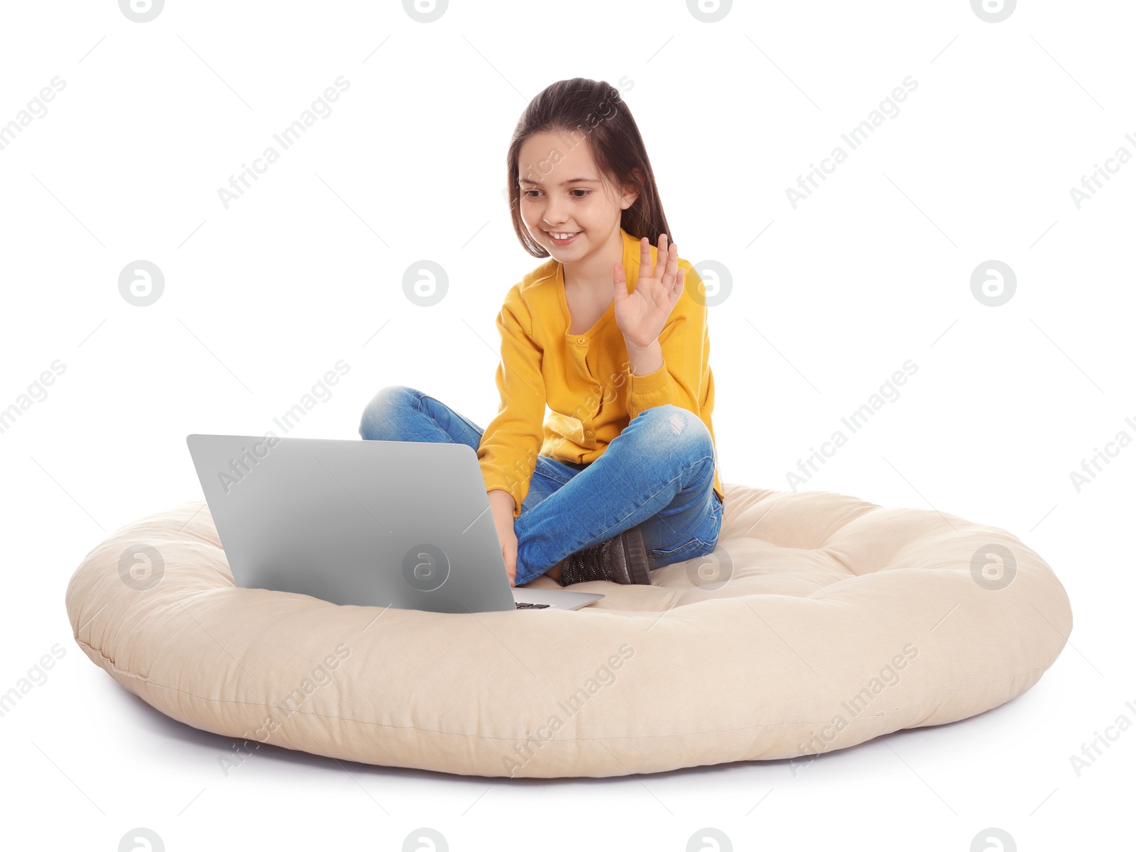 Photo of Little girl using video chat on laptop, white background