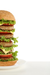 Photo of Tasty huge burger with cheese on white background