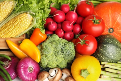 Photo of Different fresh vegetables as background, closeup view