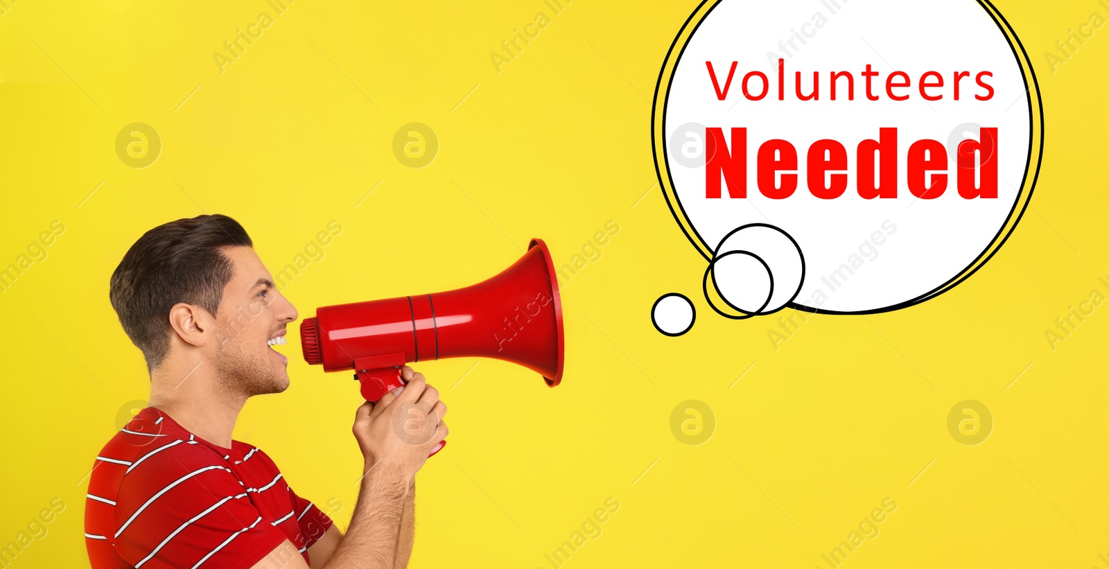 Image of Young man with megaphone and text VOLUNTEERS NEEDED on yellow background