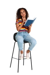 Beautiful African-American woman reading book on white background