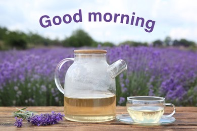 Image of Tasty herbal tea and fresh flowers on wooden table in lavender field. Good morning 