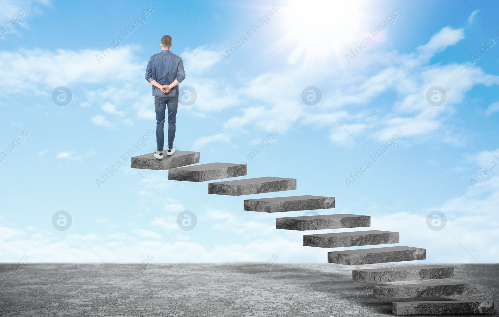 Image of Man standing on top of stairs and looking at beautiful sky. Way to success