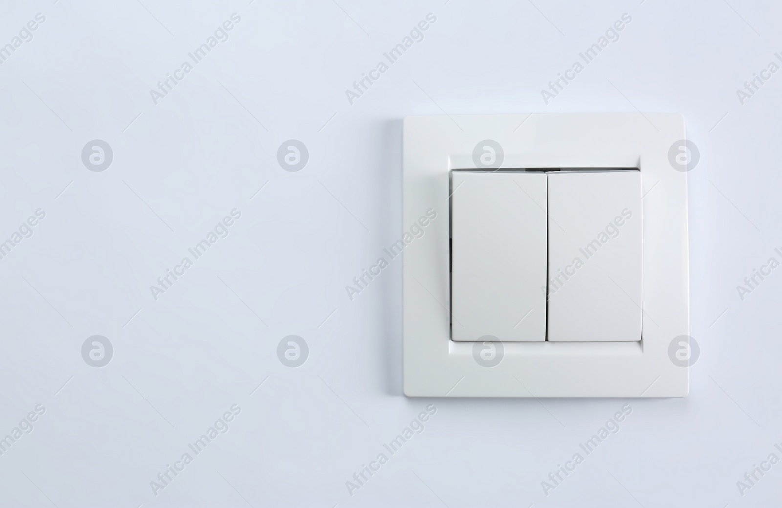 Photo of Light switch on white background. Electrician's equipment