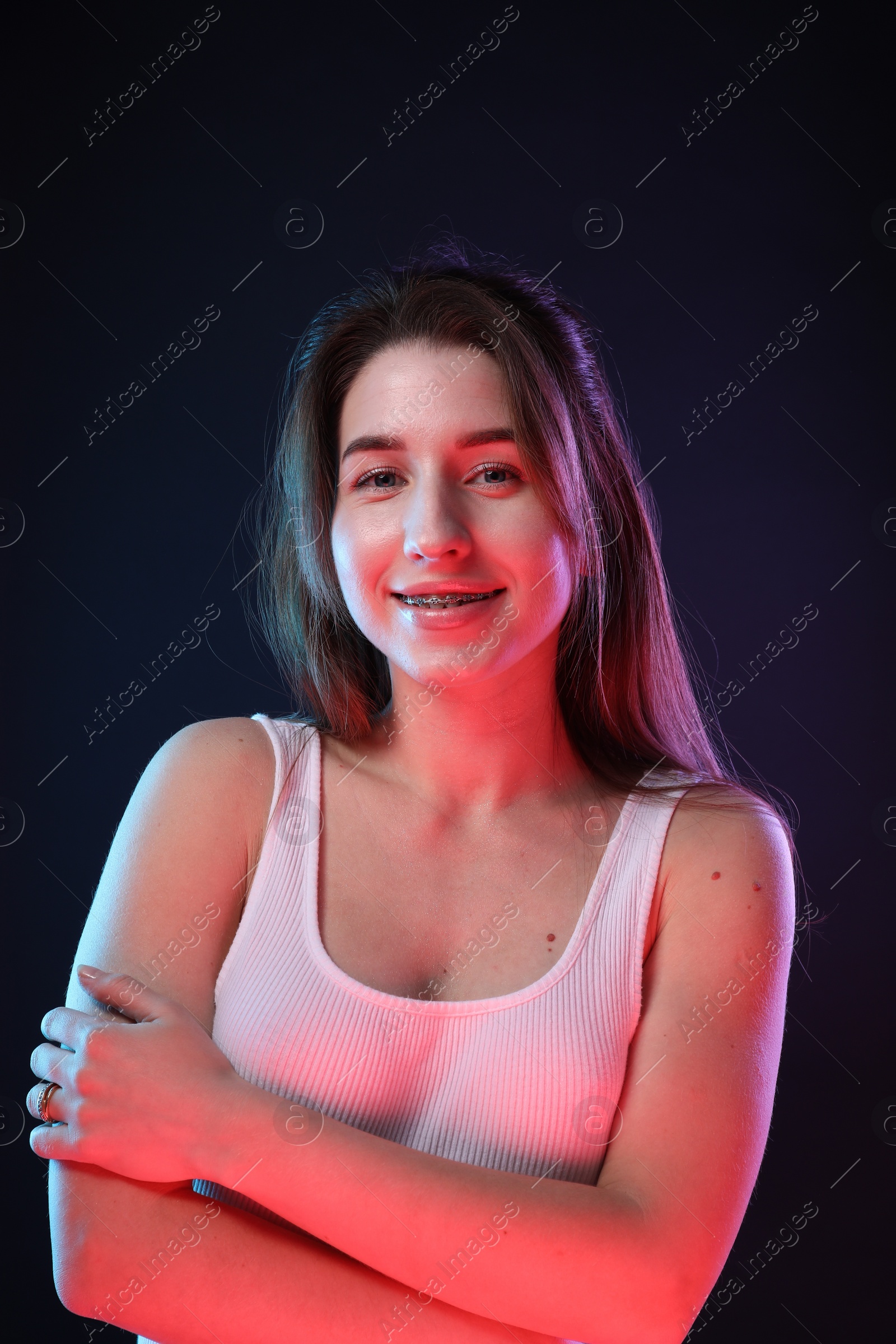 Photo of Portrait of beautiful young woman on color background