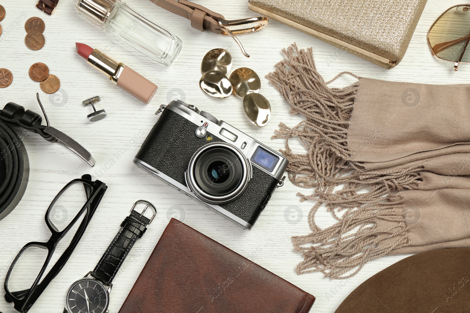 Photo of Fashionable male and female accessories on white wooden background, flat lay