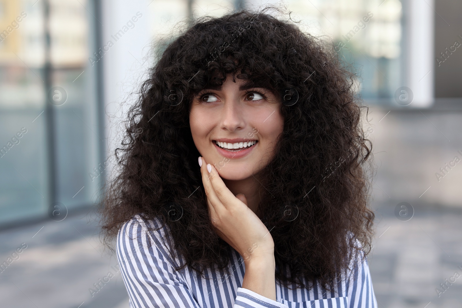 Photo of Portrait of beautiful woman outdoors. Attractive lady smiling and posing for camera