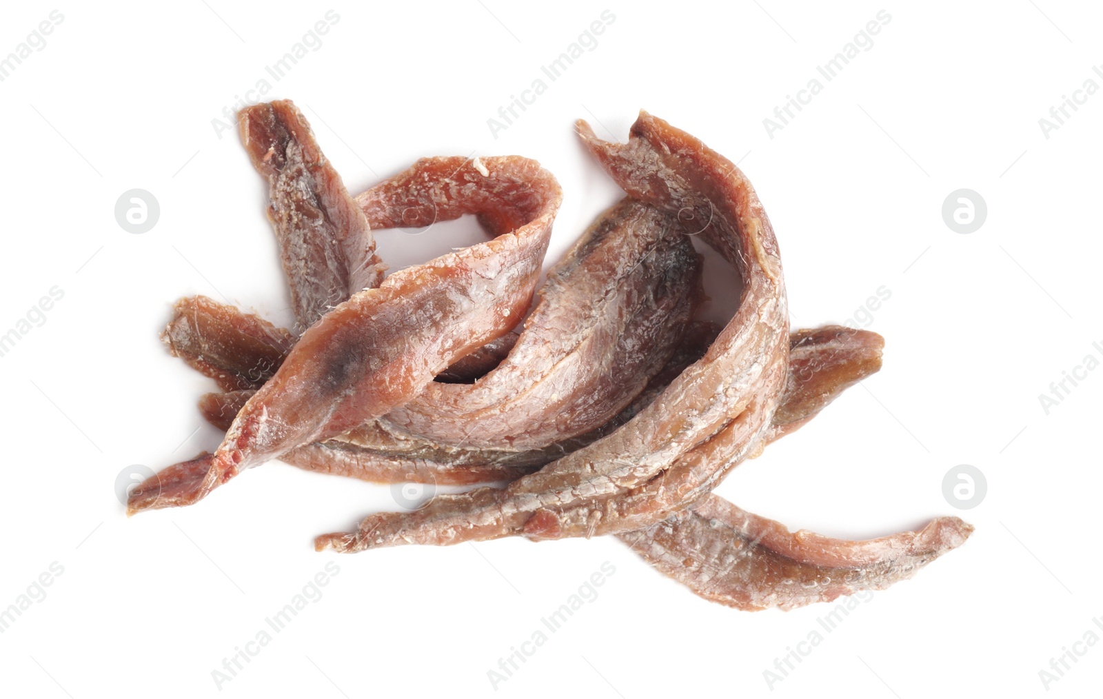 Photo of Heap of delicious anchovy fillets on white background, top view