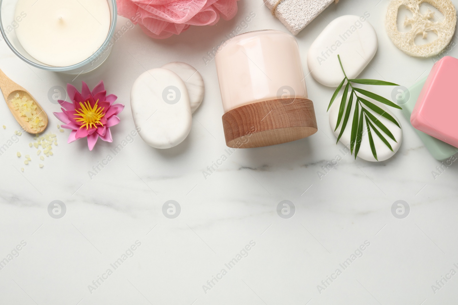 Photo of Flat lay composition with different spa products on white marble table. Space for text