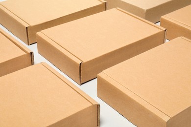 Photo of Many cardboard boxes on white background. Packaging goods